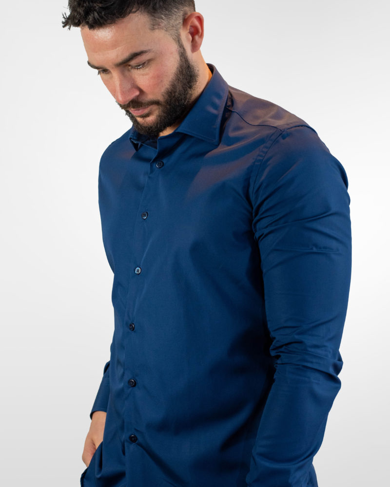 Dark blue non iron cotton shirt with single cuff and a moderate cut away collar. Contemporary fit.